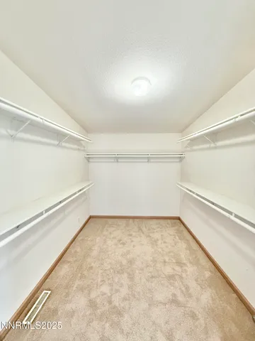 a view of a room with an empty space