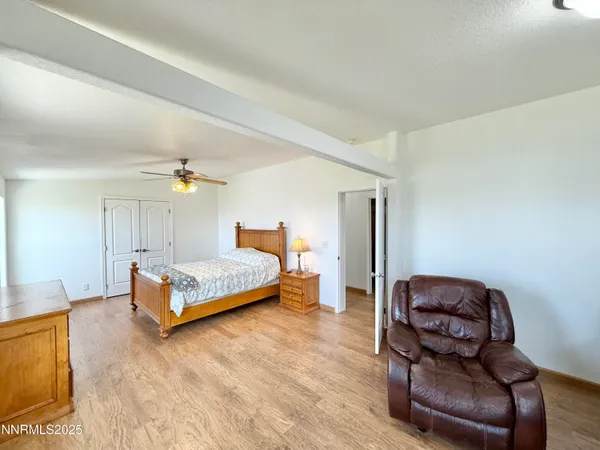 a bedroom with a bed and lamp