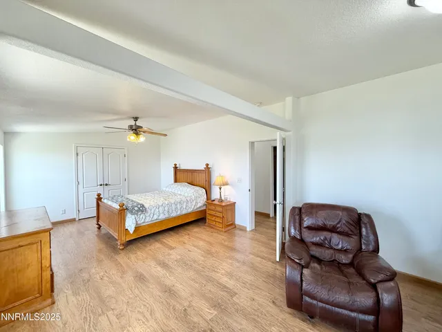 a bedroom with a bed and lamp