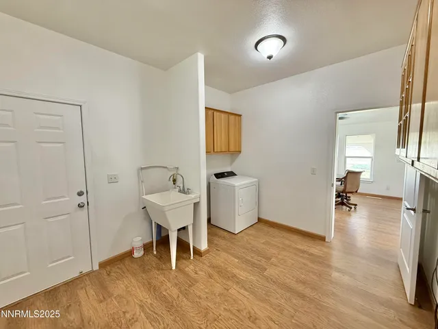 a view of a room with gym equipment and a window