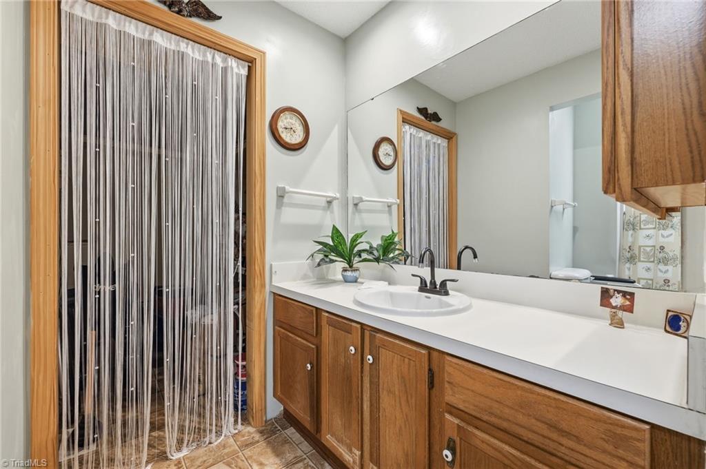 118 Honey Road Stokesdale, NC 27357 - Photo 21 of 39 Primary bathroom also has a large storage area
