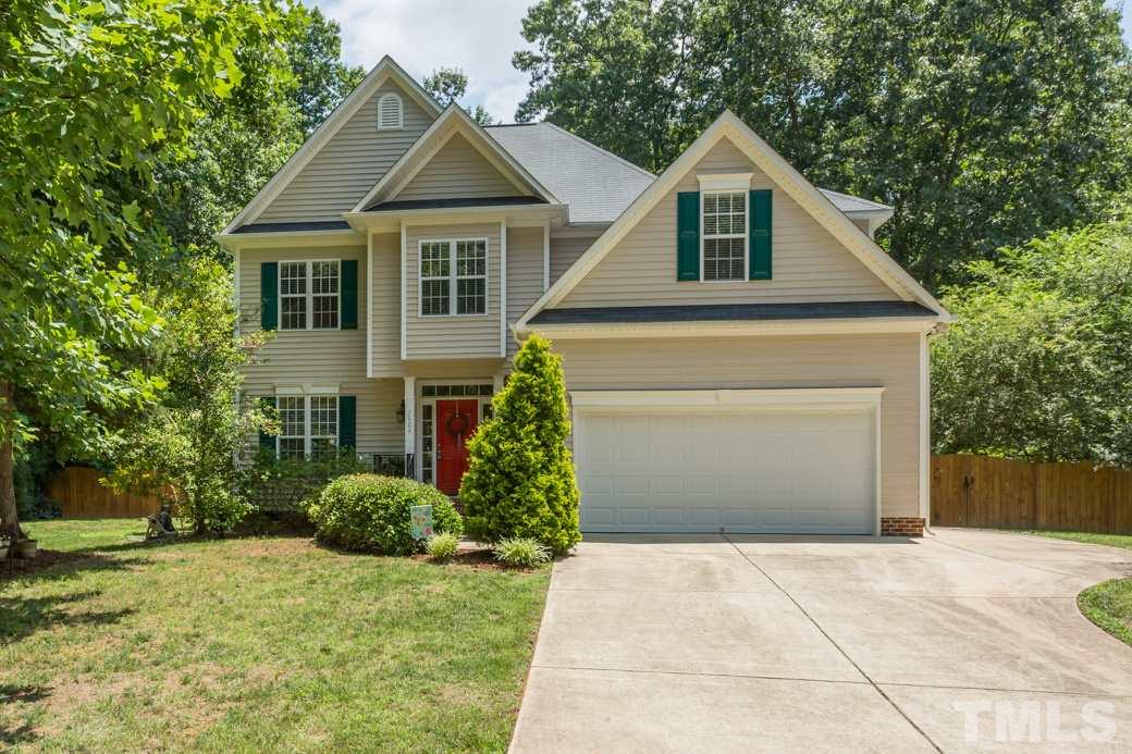 7604 Rambeau Circle Raleigh, NC 27613 - Photo 1 of 25 a front view of a house with garden