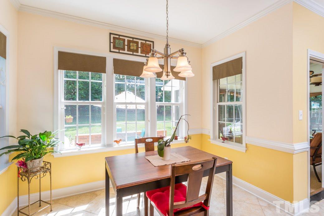 7604 Rambeau Circle Raleigh, NC 27613 - Photo 12 of 25 a view of a dining room with furniture window and outside view