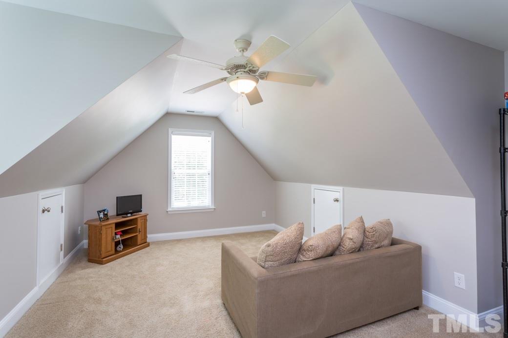 7604 Rambeau Circle Raleigh, NC 27613 - Photo 15 of 25 a living room with furniture and a ceiling fan