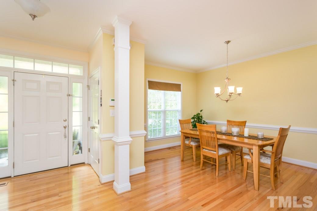 7604 Rambeau Circle Raleigh, NC 27613 - Photo 3 of 25 a view of a dining room with furniture and wooden floor