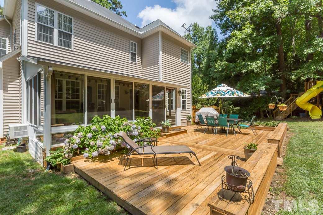 7604 Rambeau Circle Raleigh, NC 27613 - Photo 22 of 25 a house view with a seating space and garden view