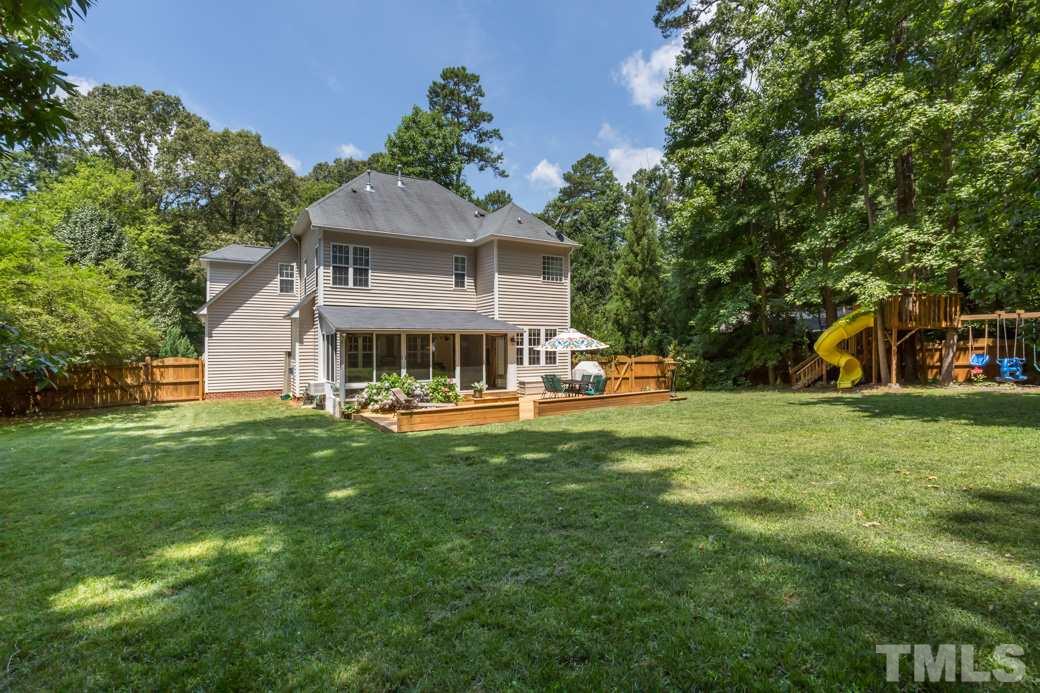 7604 Rambeau Circle Raleigh, NC 27613 - Photo 23 of 25 a front view of a house with garden