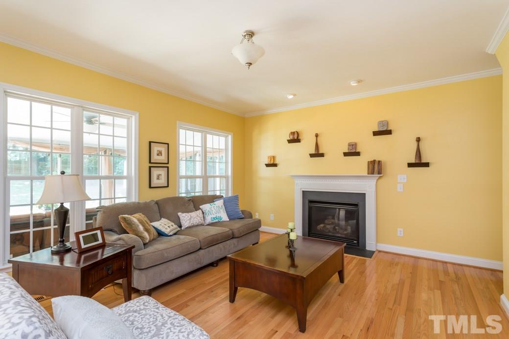 7604 Rambeau Circle Raleigh, NC 27613 - Photo 4 of 25 a living room with furniture and a fireplace
