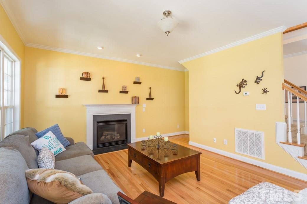7604 Rambeau Circle Raleigh, NC 27613 - Photo 5 of 25 a living room with furniture and a fireplace