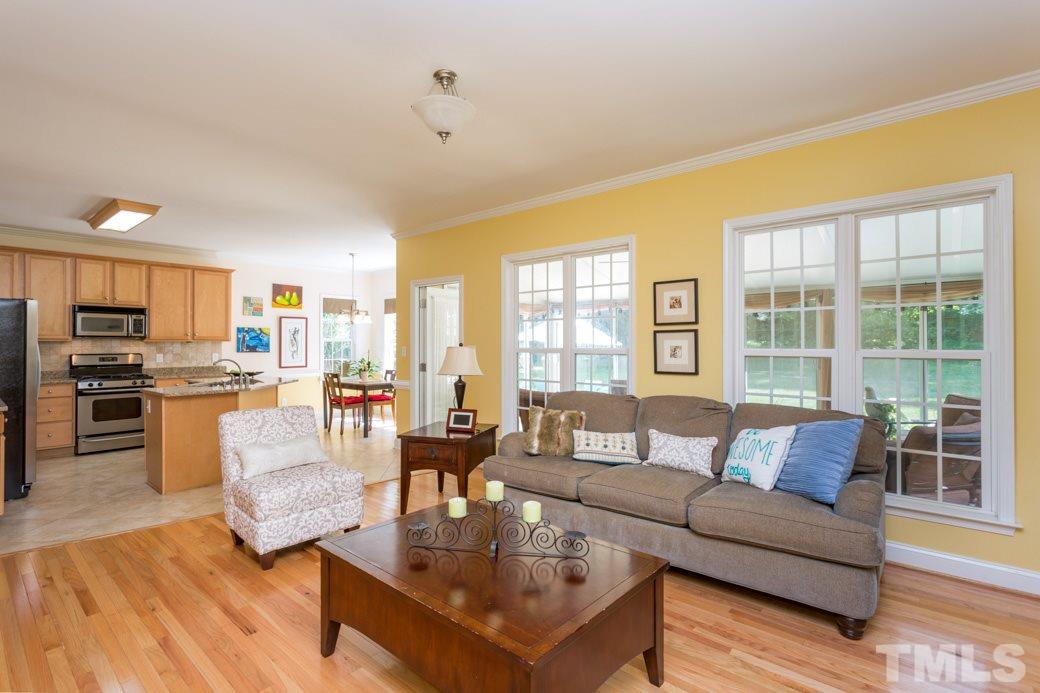 7604 Rambeau Circle Raleigh, NC 27613 - Photo 6 of 25 a living room with furniture and a large window