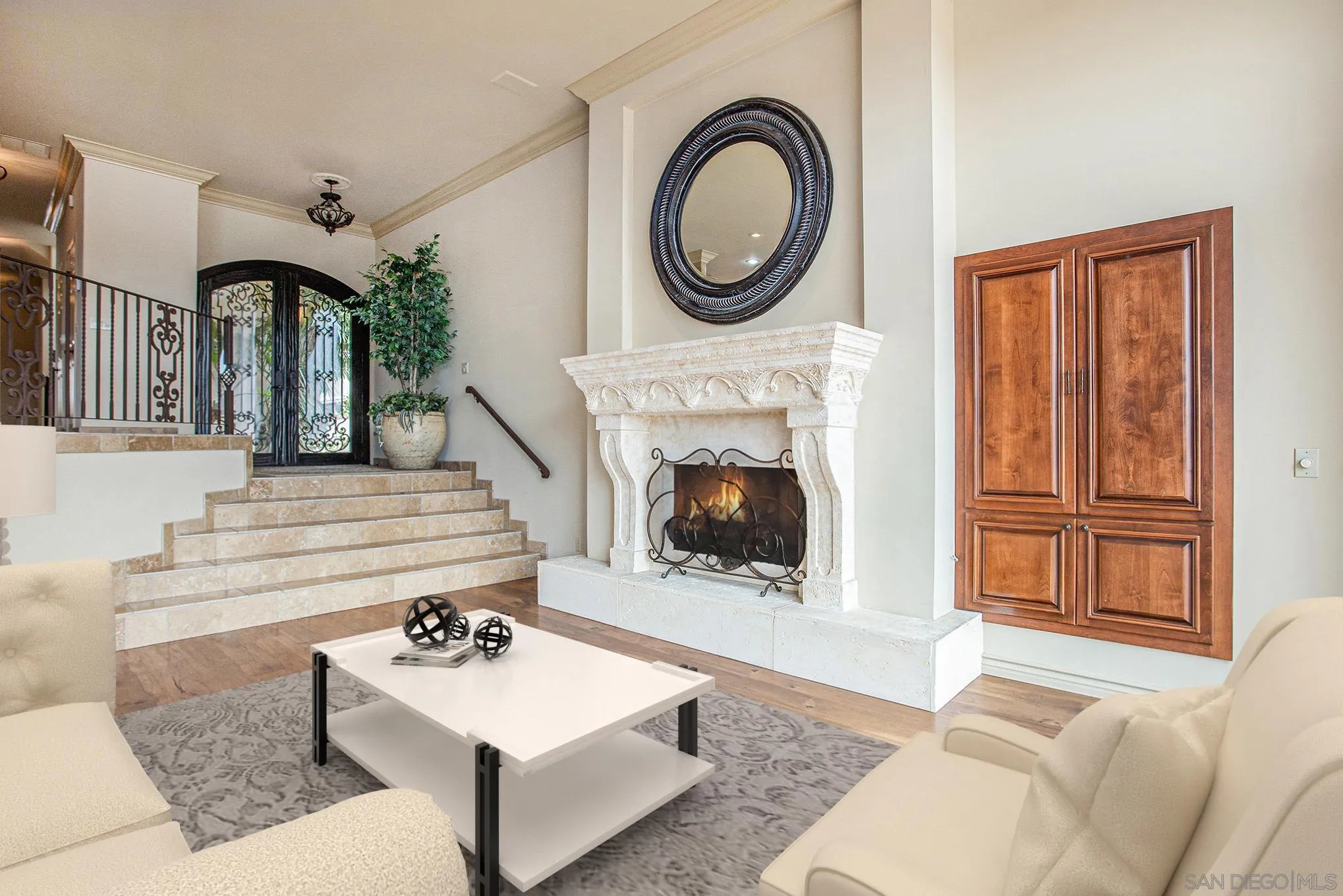 34 The Point Coronado, CA 92118 - Photo 11 of 71 a living room with furniture a flat screen tv and a fireplace