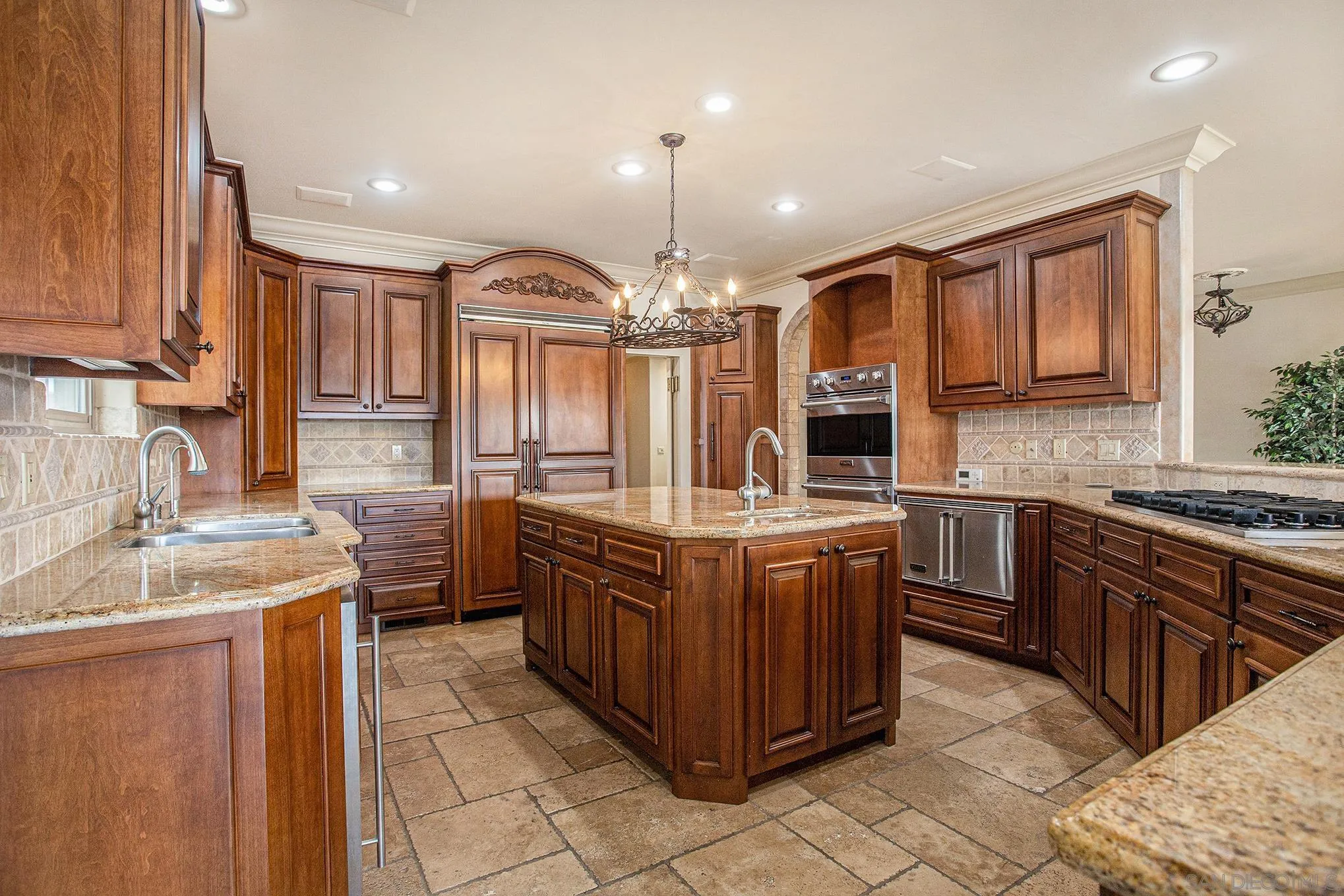 34 The Point Coronado, CA 92118 - Photo 18 of 71 a large kitchen with granite countertop a sink and a stove