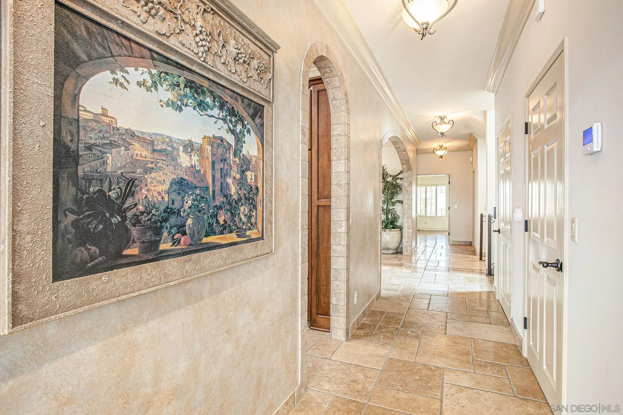 34 The Point Coronado, CA 92118 - Photo 20 of 71 a view of a hallway with wooden floor and a large kitchen living room