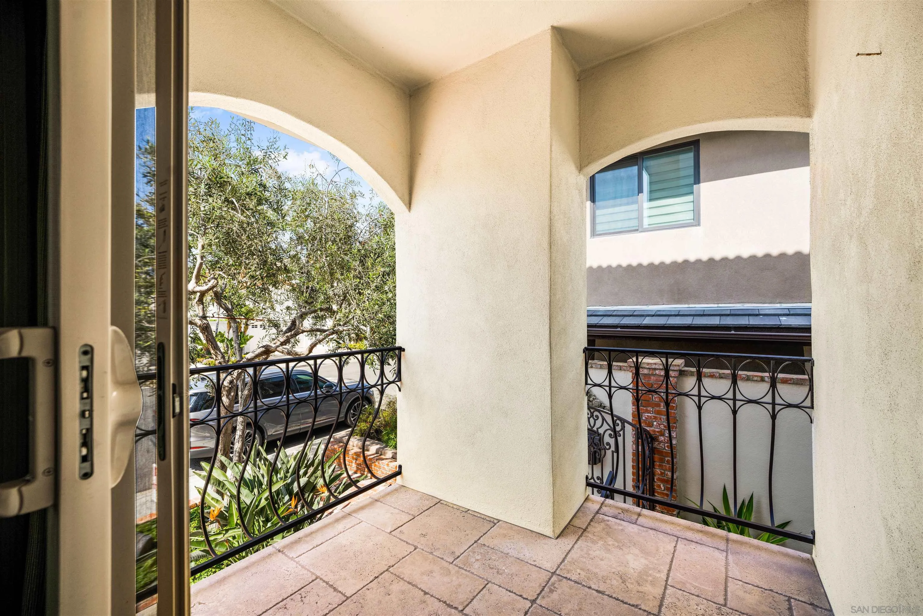 34 The Point Coronado, CA 92118 - Photo 26 of 71 a view of a porch with a door and wooden floor