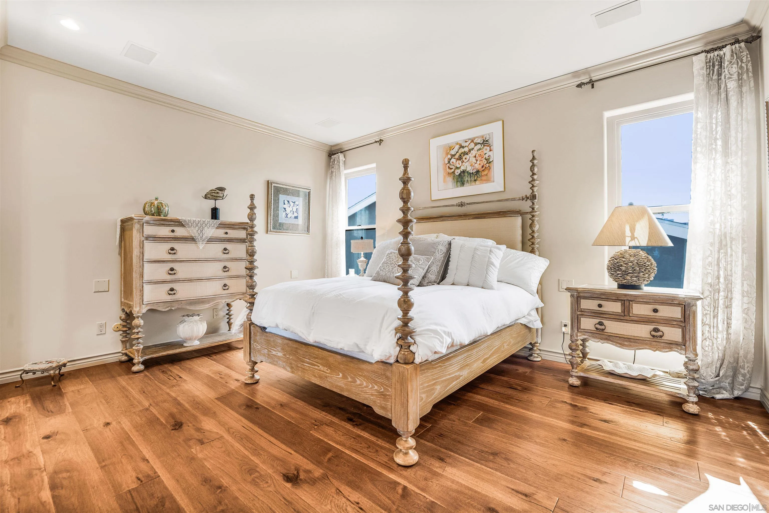 34 The Point Coronado, CA 92118 - Photo 29 of 71 a bedroom with a bed and a cabinets