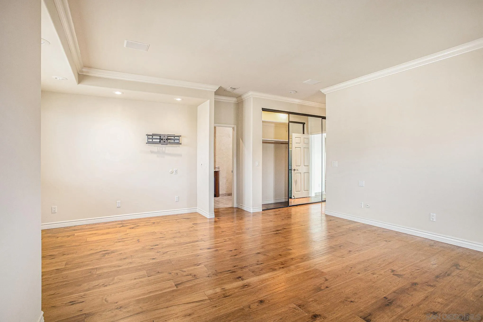 34 The Point Coronado, CA 92118 - Photo 33 of 71 a view of an empty room with wooden floor and a window