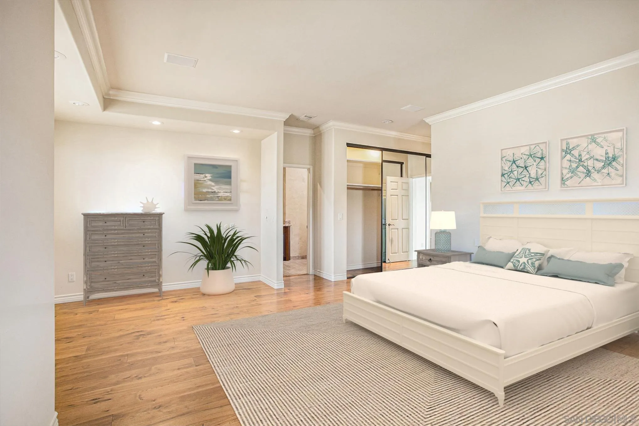 34 The Point Coronado, CA 92118 - Photo 34 of 71 a bedroom with a large bed and potted plant