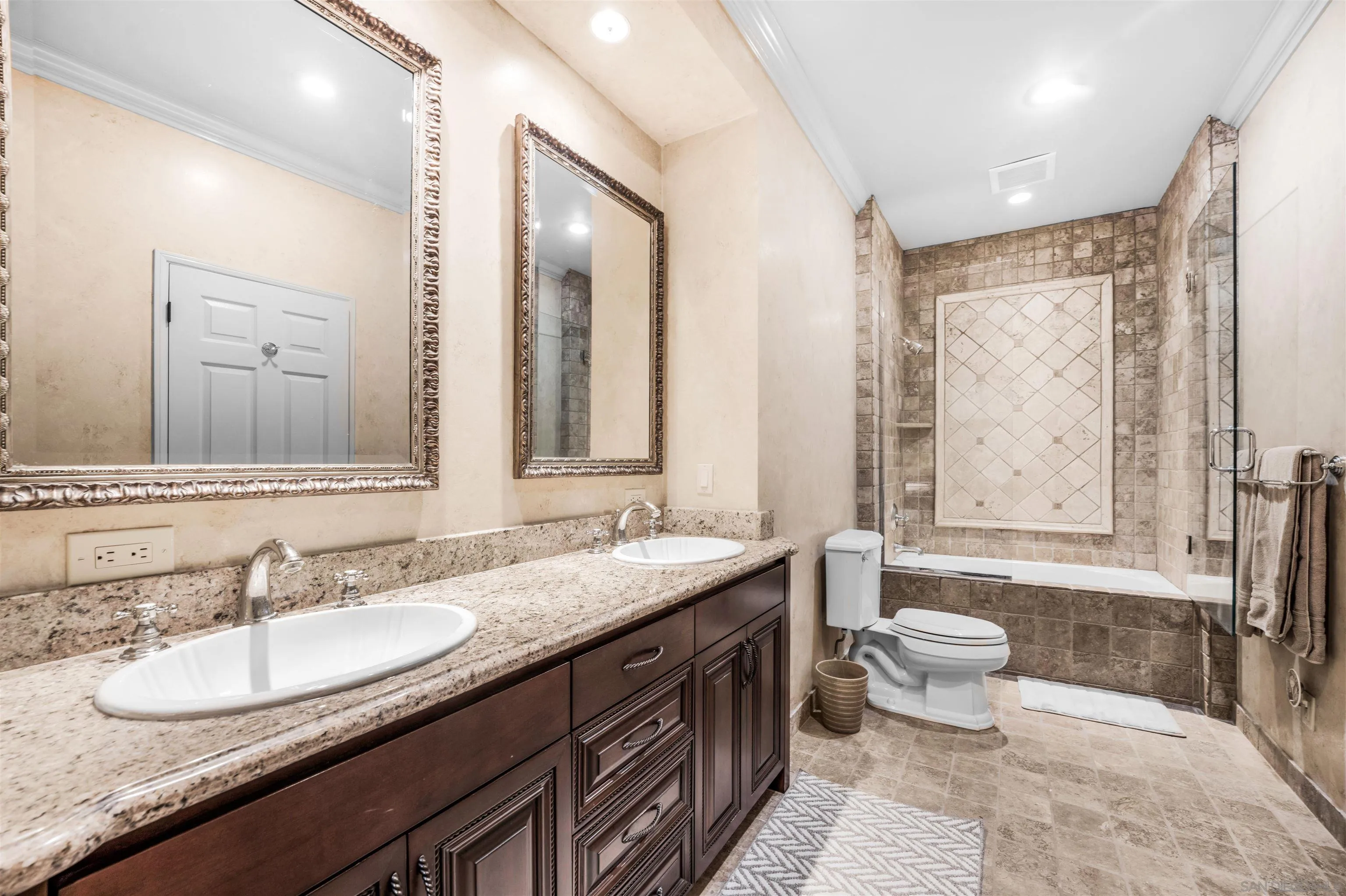 34 The Point Coronado, CA 92118 - Photo 37 of 71 a bathroom with a granite countertop sink and a mirror
