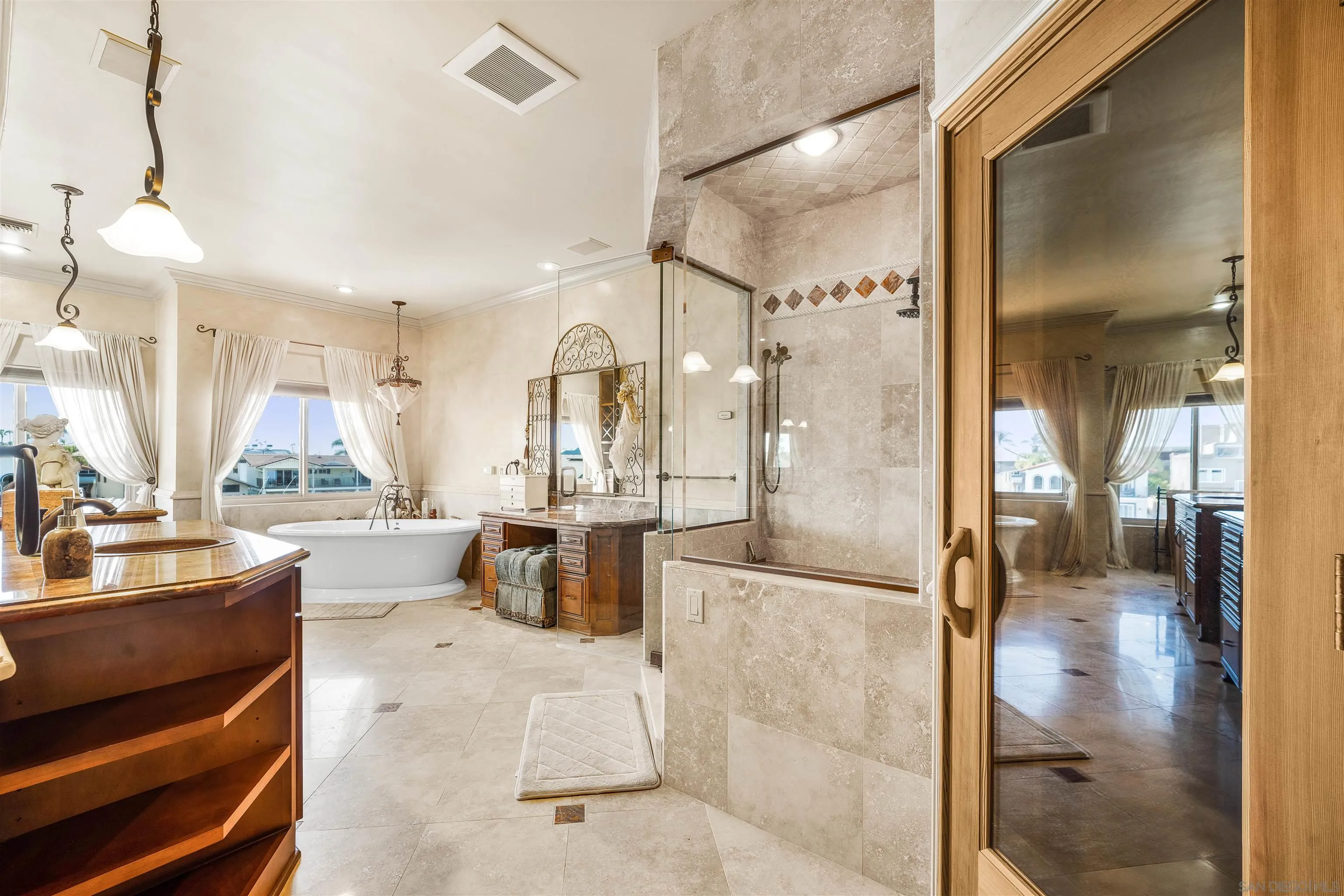 34 The Point Coronado, CA 92118 - Photo 47 of 71 a bathroom with a double vanity sink mirror and shower