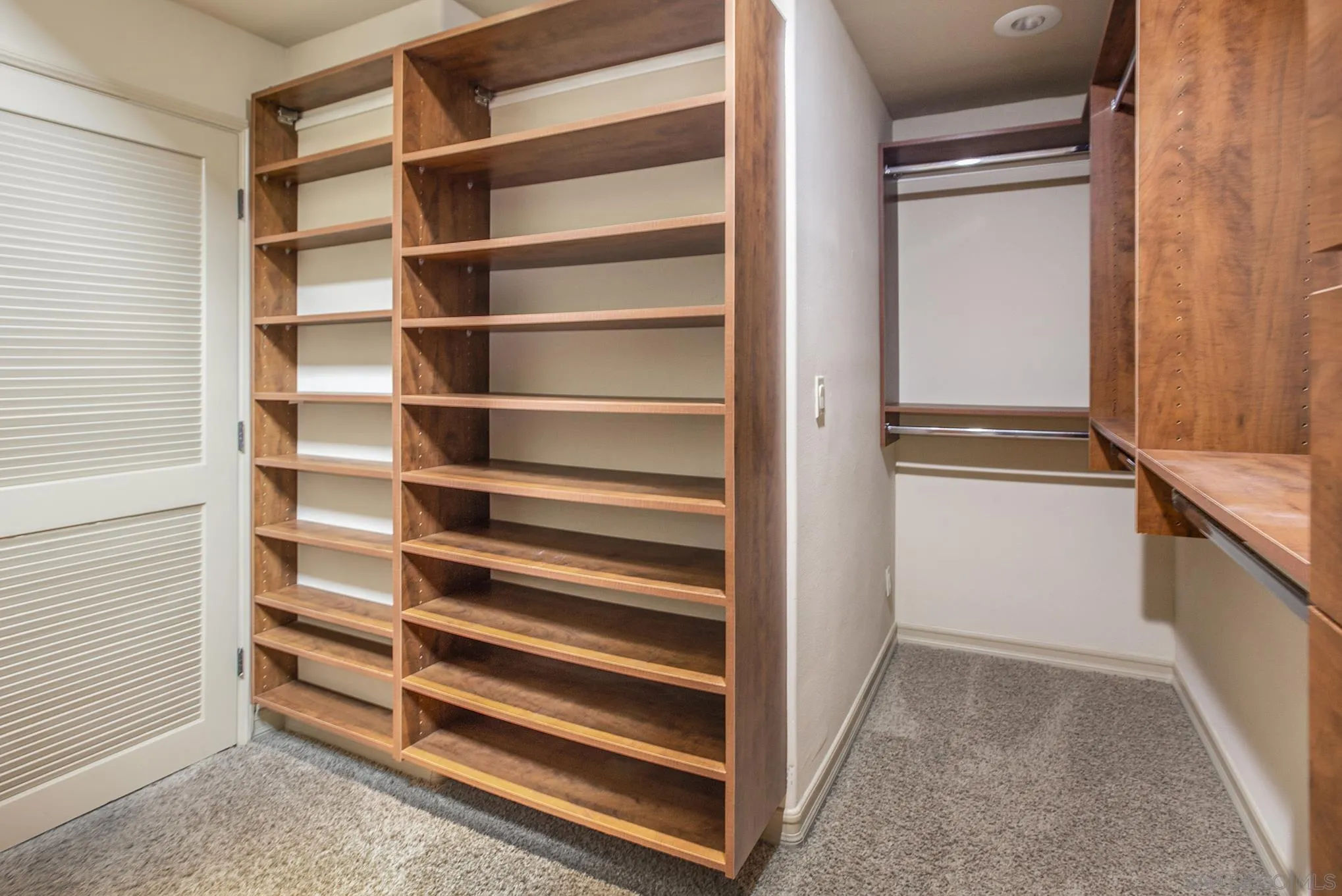 34 The Point Coronado, CA 92118 - Photo 49 of 71 a view of walk in closet with empty racks