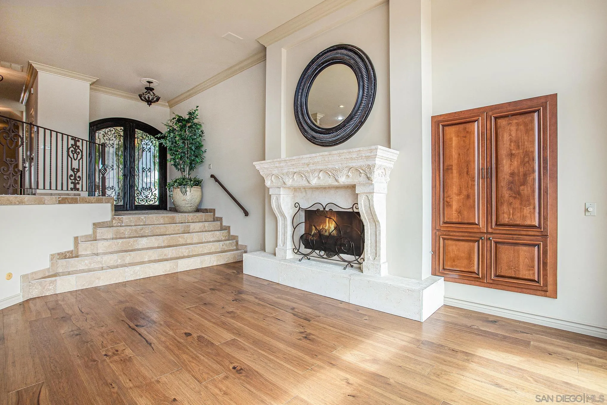 34 The Point Coronado, CA 92118 - Photo 10 of 71 a view of a livingroom with a fireplace a rug and a window