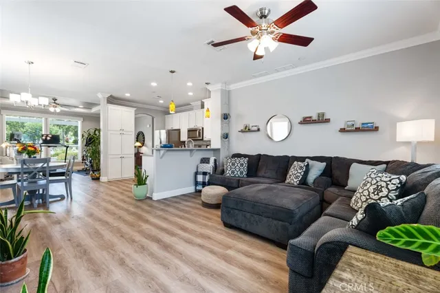 a living room with a fireplace and a flat screen tv