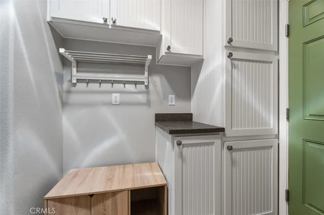 a bedroom with a bed and a desk