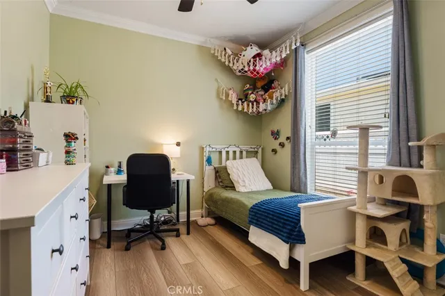 a view of a hallway with wooden floor and cabinet with a yard