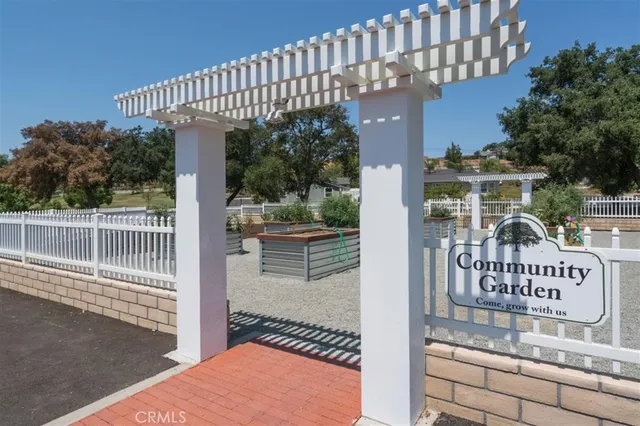 a view of a park with iron fence