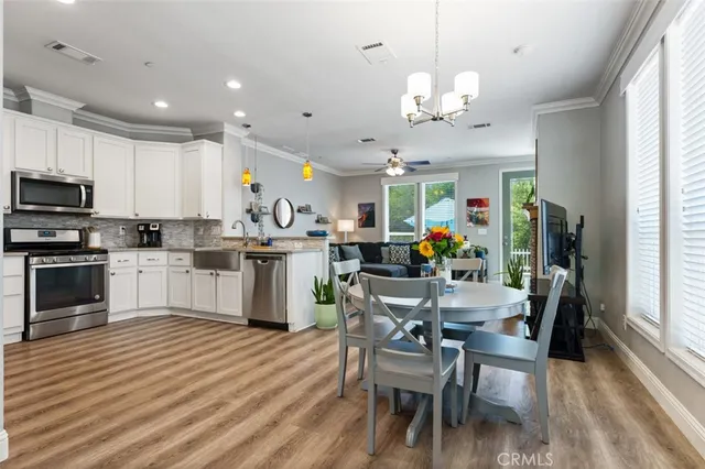 a kitchen with sink and refrigerator