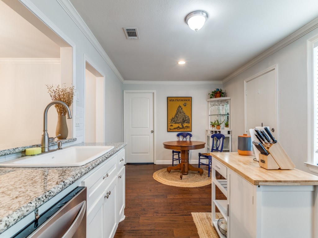 5110 Cochran Street Houston, TX 77009 - Photo 11 of 23 a room with sink washer and lots of wooden furniture