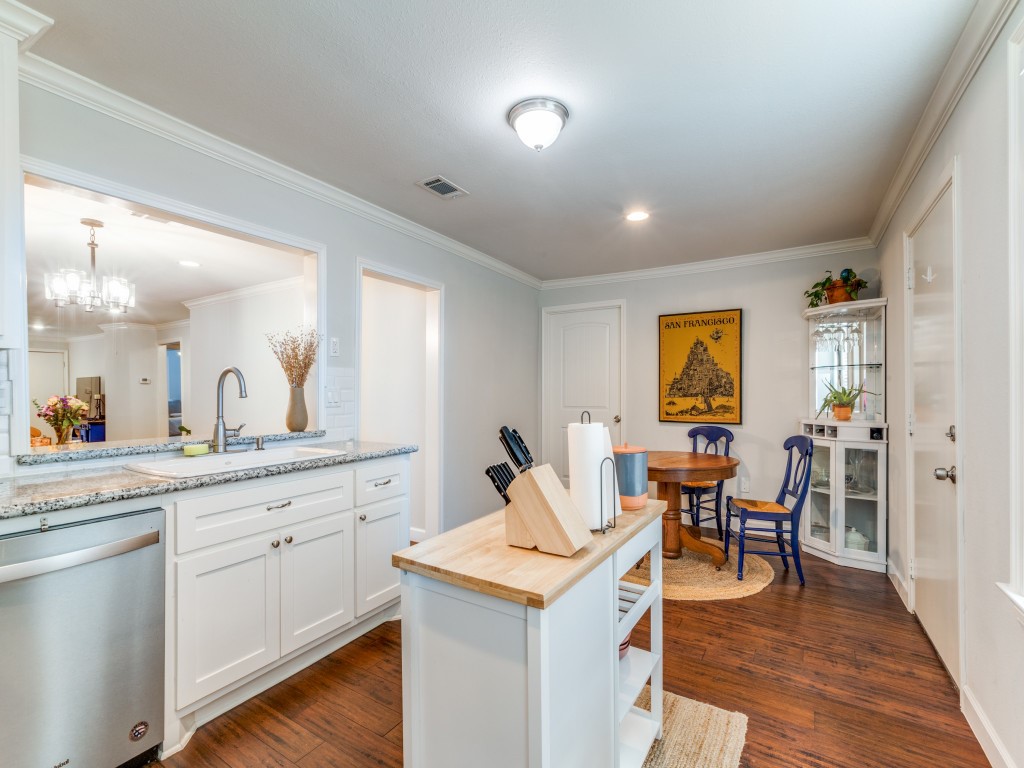 5110 Cochran Street Houston, TX 77009 - Photo 12 of 23 a living room with a sink and dishwasher with wooden floor