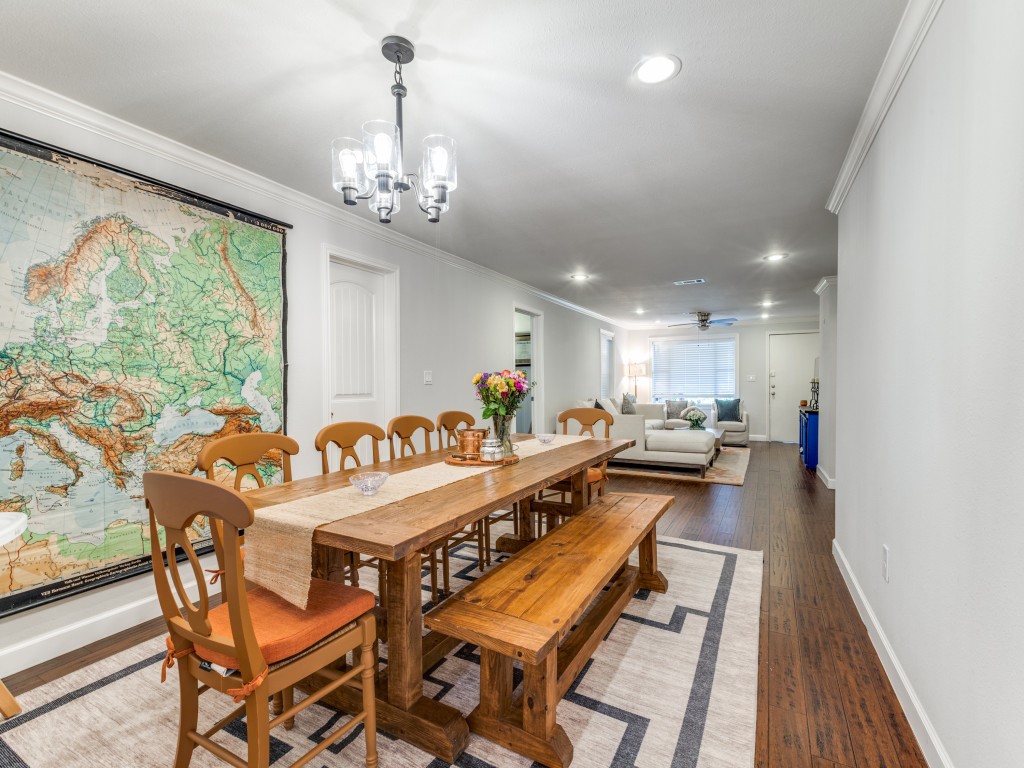 5110 Cochran Street Houston, TX 77009 - Photo 7 of 23 a large dining space with furniture a chandelier and wooden floor