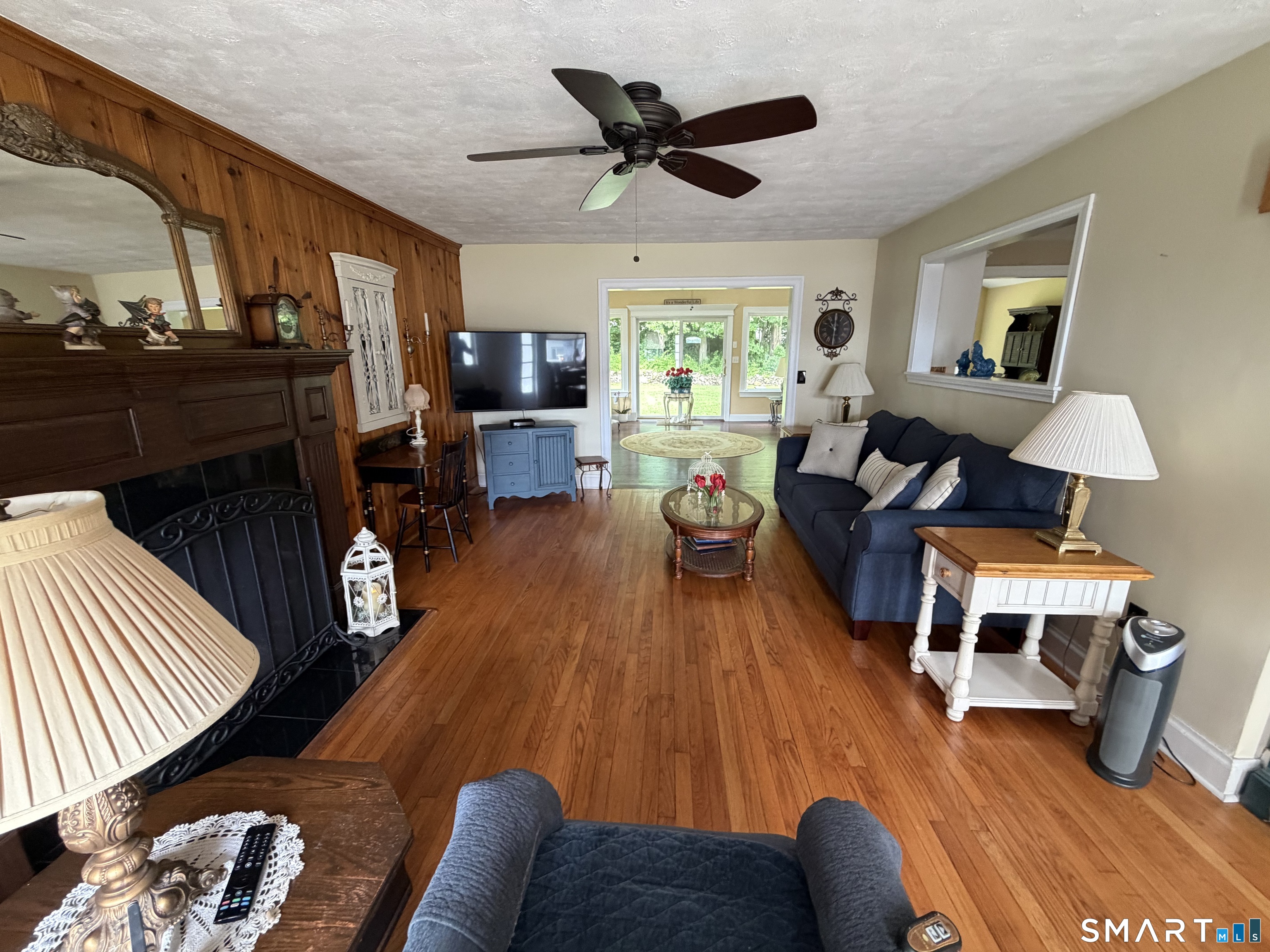 109 Chasse Road Wolcott, CT 06716 - Photo 15 of 22 a living room with furniture or couch and a fireplace