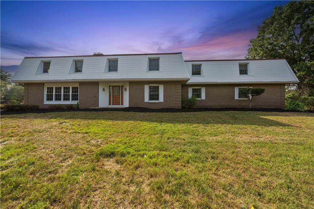 185 Reed Road Avella, PA 15312 - Photo 1 of 50 a front view of a house with a garden