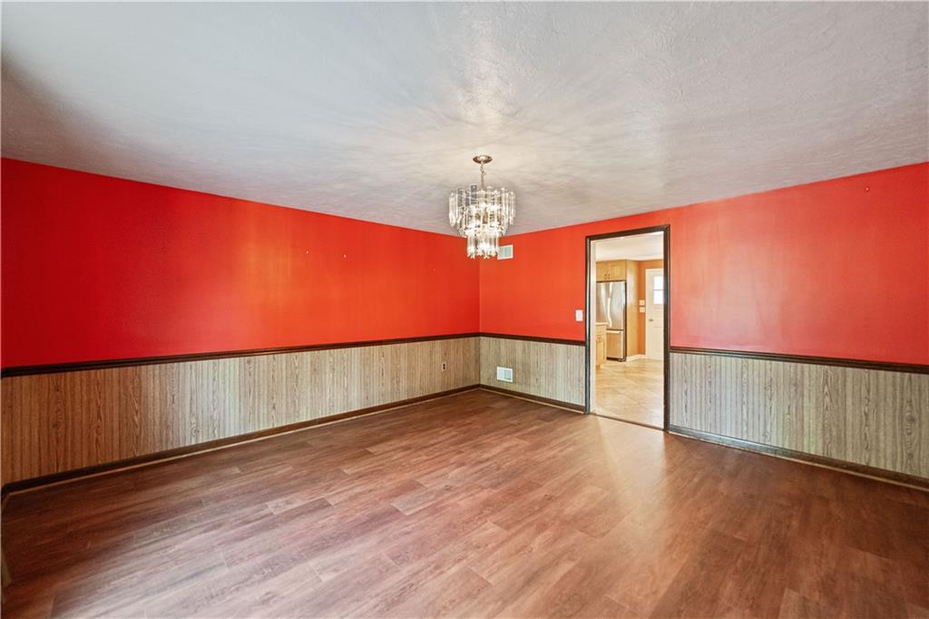 185 Reed Road Avella, PA 15312 - Photo 14 of 50 a view of an empty room with wooden floor and a window