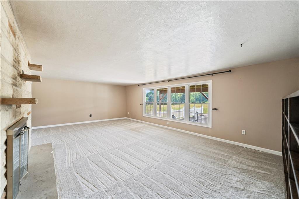 185 Reed Road Avella, PA 15312 - Photo 21 of 50 an empty room with wooden floor and windows