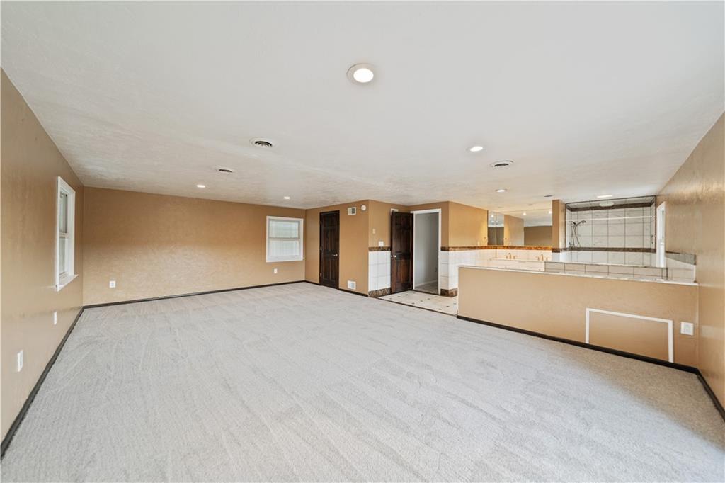 185 Reed Road Avella, PA 15312 - Photo 23 of 50 a view of an empty room with kitchen and window
