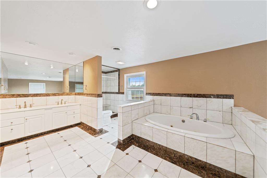 185 Reed Road Avella, PA 15312 - Photo 24 of 50 a bathroom with a bathtub and a sink