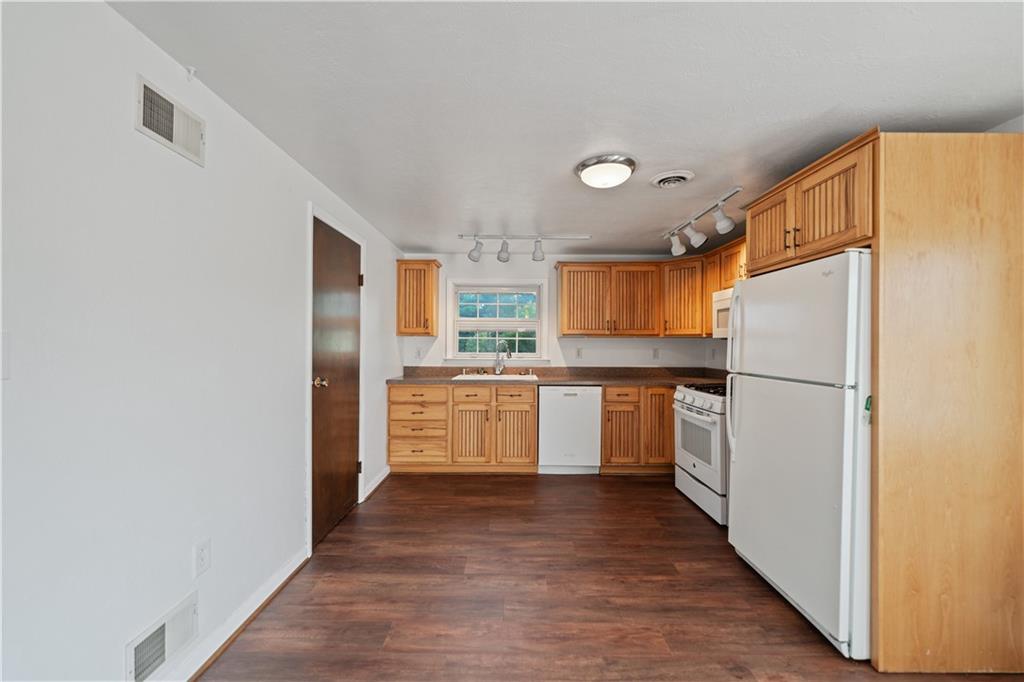 185 Reed Road Avella, PA 15312 - Photo 33 of 50 a kitchen with stainless steel appliances a refrigerator and a stove top oven