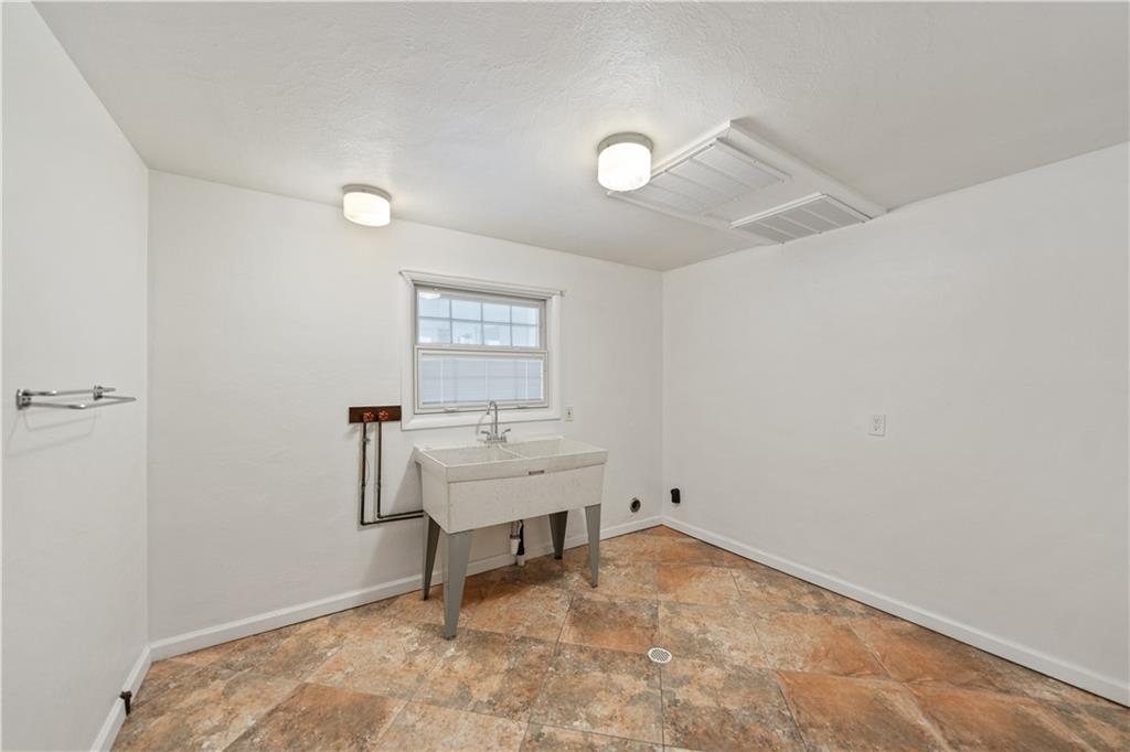 185 Reed Road Avella, PA 15312 - Photo 40 of 50 a view of a room with a wooden floor and a ceiling fan
