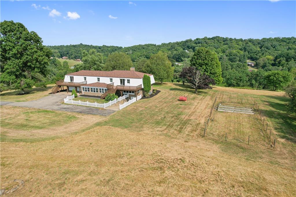 185 Reed Road Avella, PA 15312 - Photo 4 of 50 a wooden bench sitting in the middle of a field