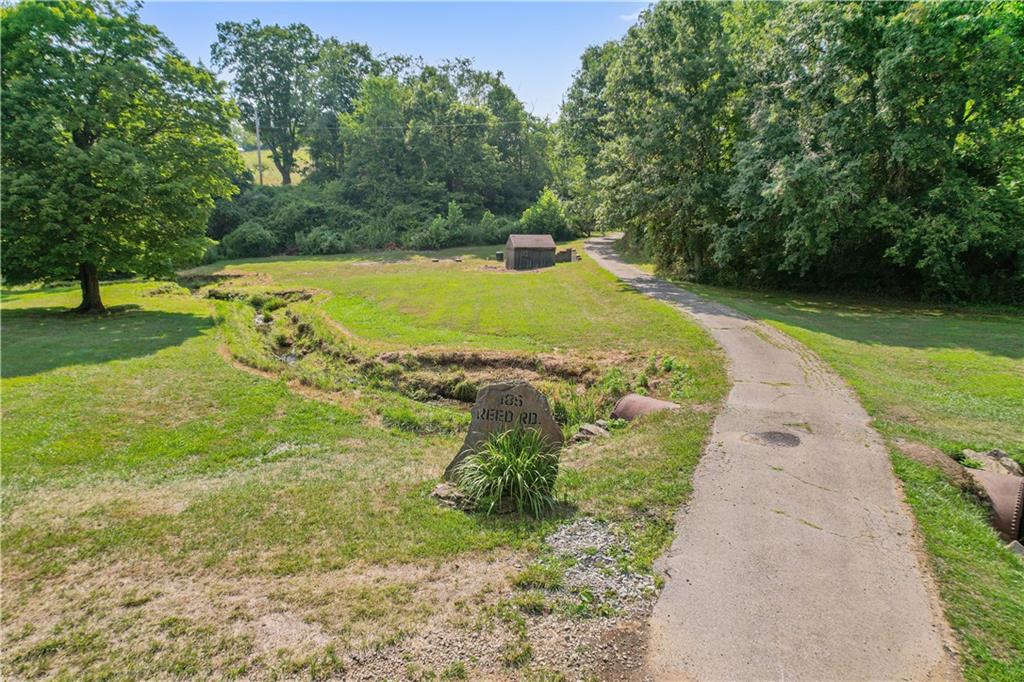 185 Reed Road Avella, PA 15312 - Photo 43 of 50 a view of a swimming pool with a yard