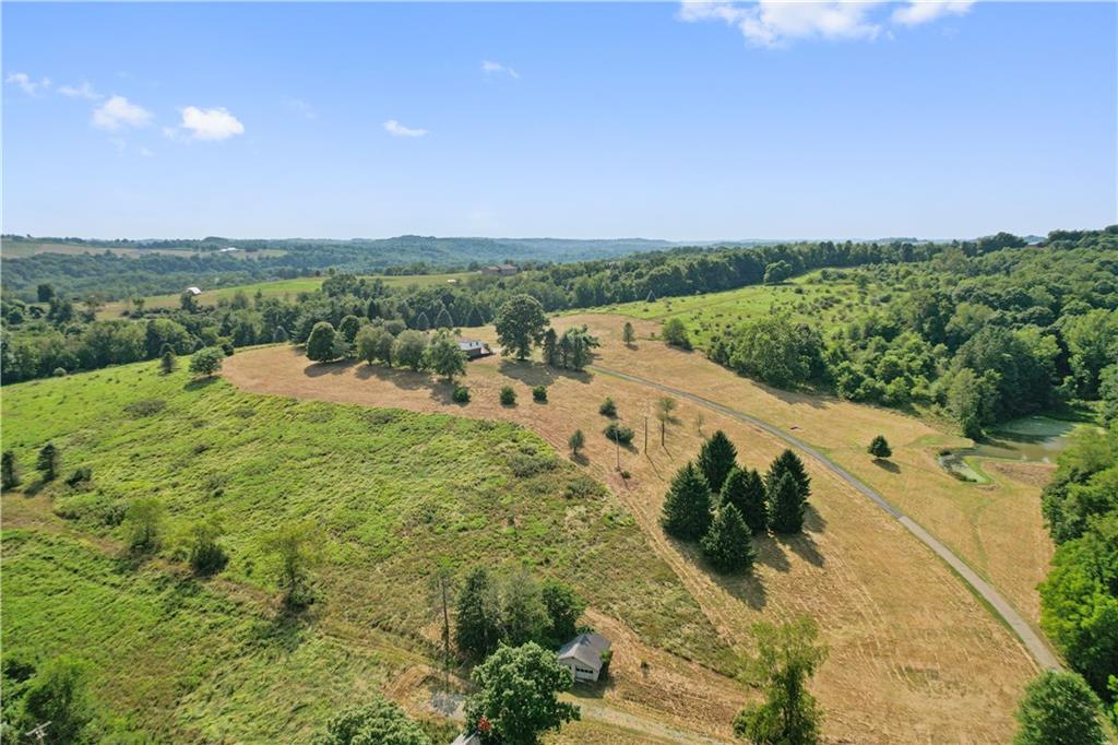 185 Reed Road Avella, PA 15312 - Photo 6 of 50 a view of a city with lush green forest