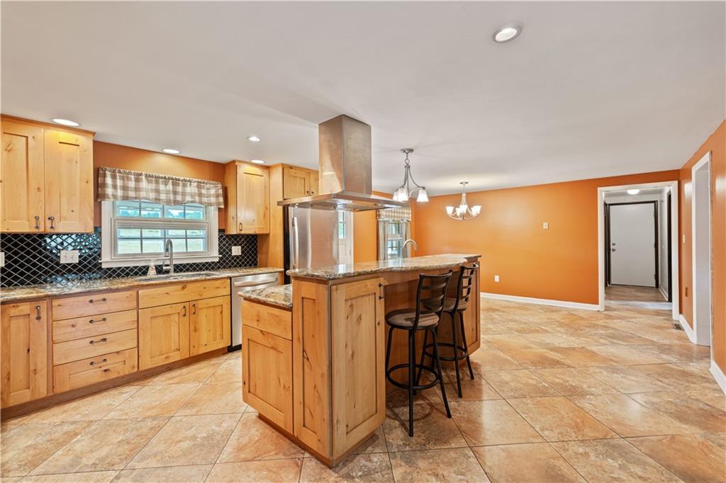 185 Reed Road Avella, PA 15312 - Photo 10 of 50 a kitchen with stainless steel appliances a sink and cabinets
