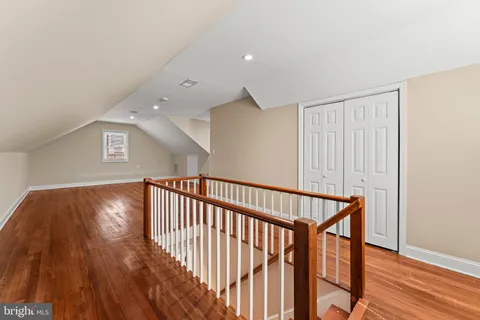 a view of hallway with wooden floor