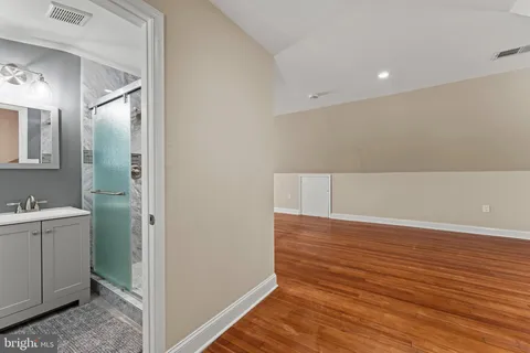 a view of room with closet and wooden floor