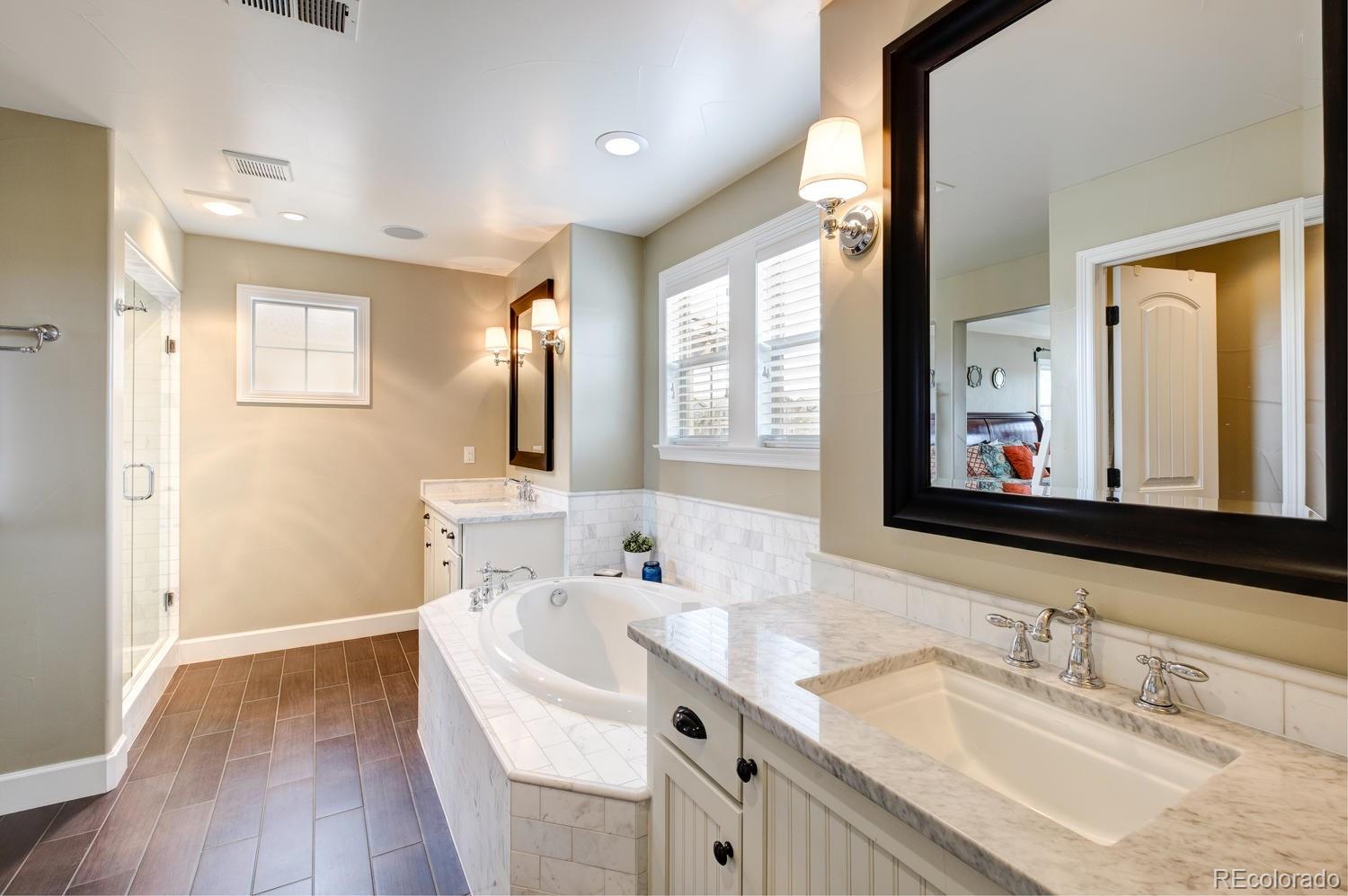 10711 Sundial Rim Road Highlands Ranch, CO 80126 - Photo 20 of 35 a bathroom with a sink vanity and mirror