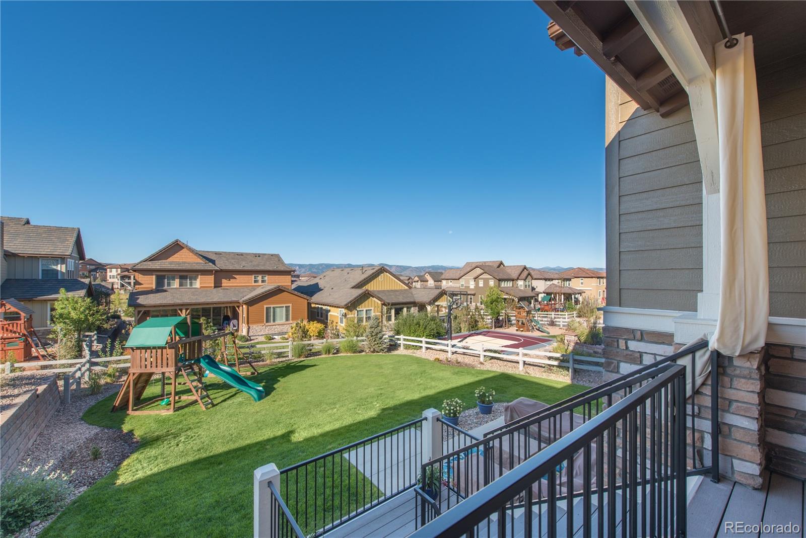 10711 Sundial Rim Road Highlands Ranch, CO 80126 - Photo 33 of 35 a view of a chairs and table on the balcony