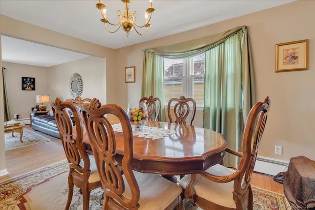 a view of a dining room with furniture window and outside view